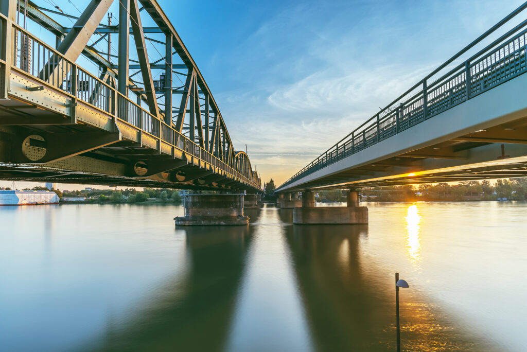 low-angle-view-bridge-river-against-sky